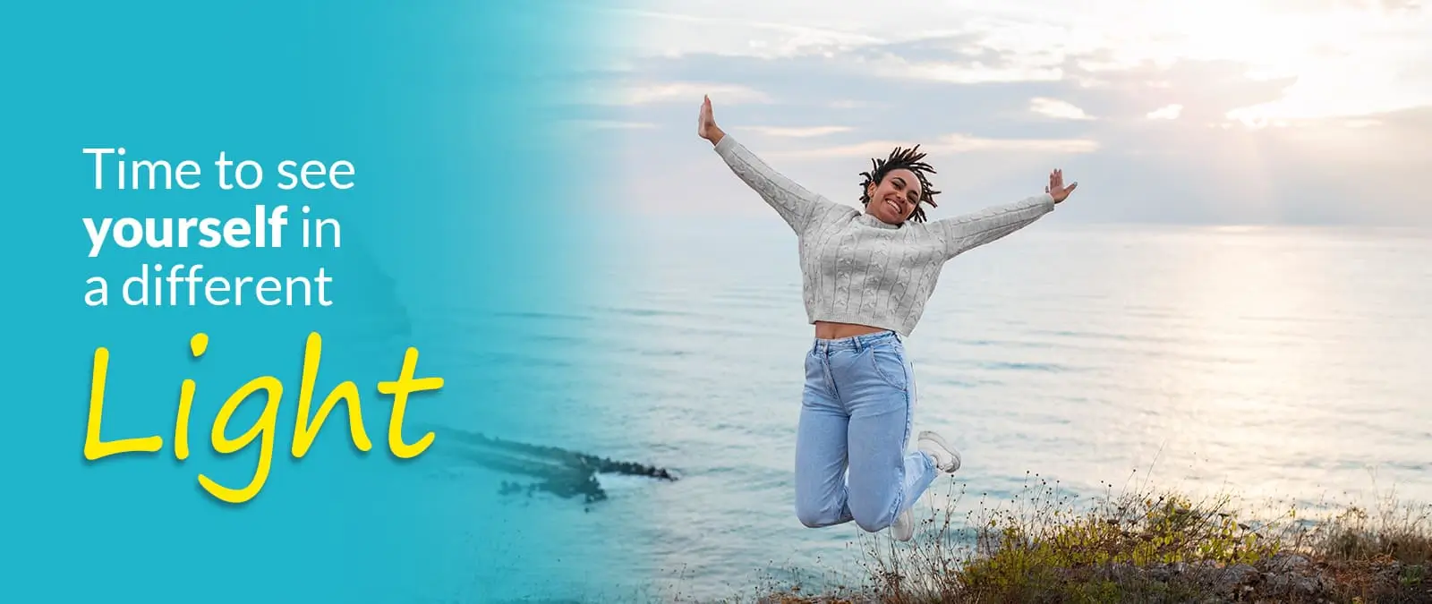 Happy woman jumping near the sea, symbolizing positive mental health and emotional recovery